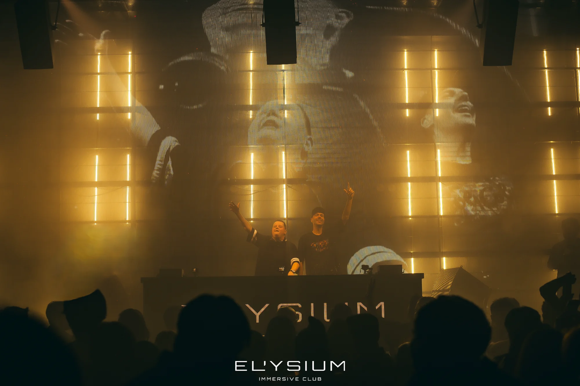 DJ performance with golden lighting